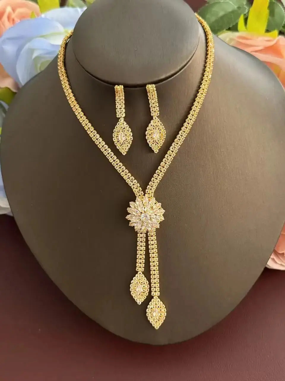 A three piece jewelry set with exquisite patterns and stunning necklaces and earrings, perfect for parties and banquets
